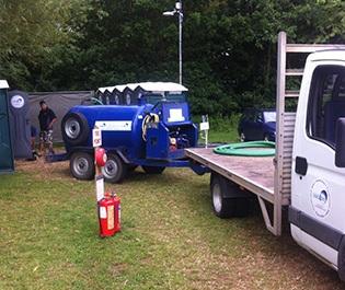 transporting a pump for cleaning portable toilets